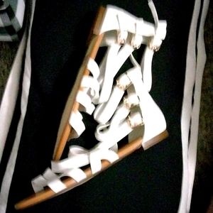 A pair of never worn white open-toe flat Sanders